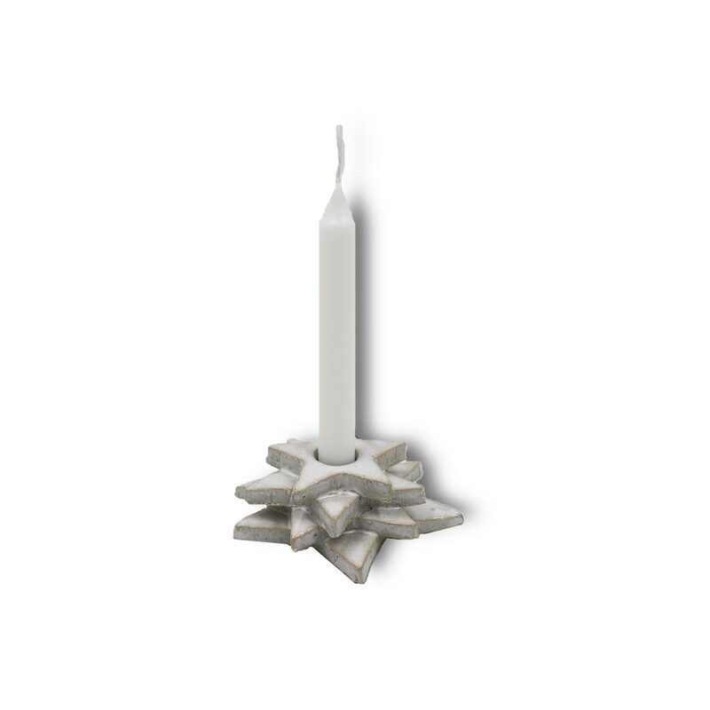 Kerzenständer in Form von Sternen